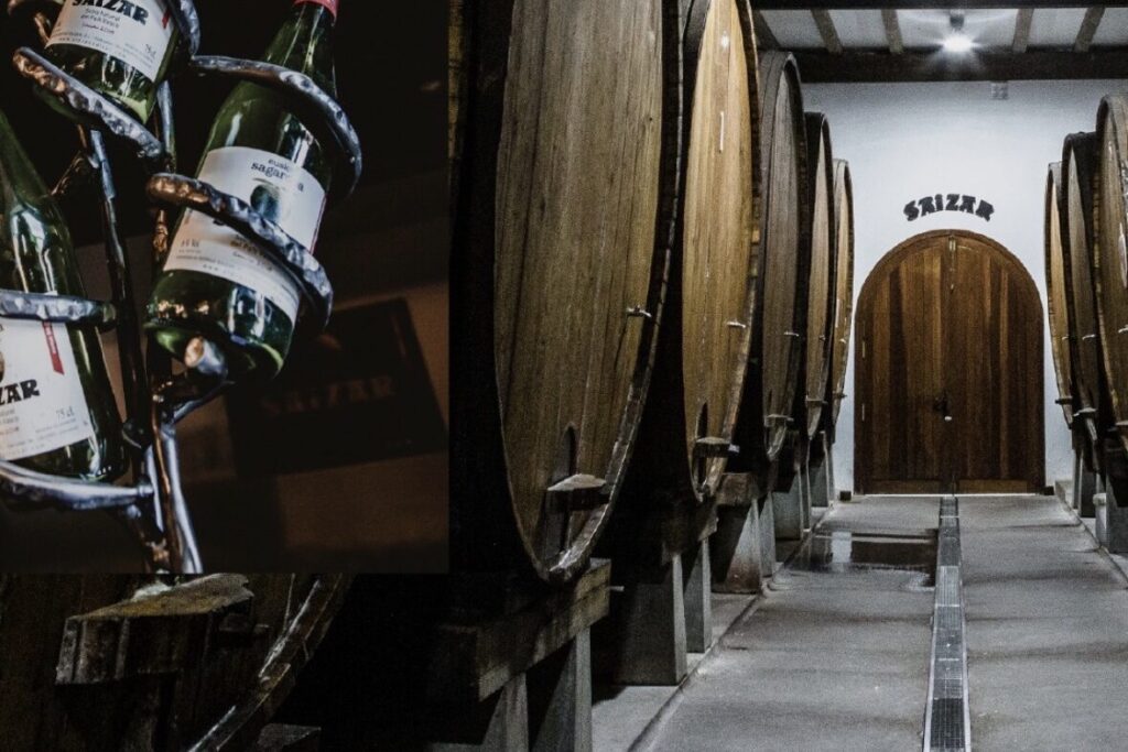 Grandi botti di legno e bottiglie di sidro nella sidreria Saizar, nei Paesi Baschi